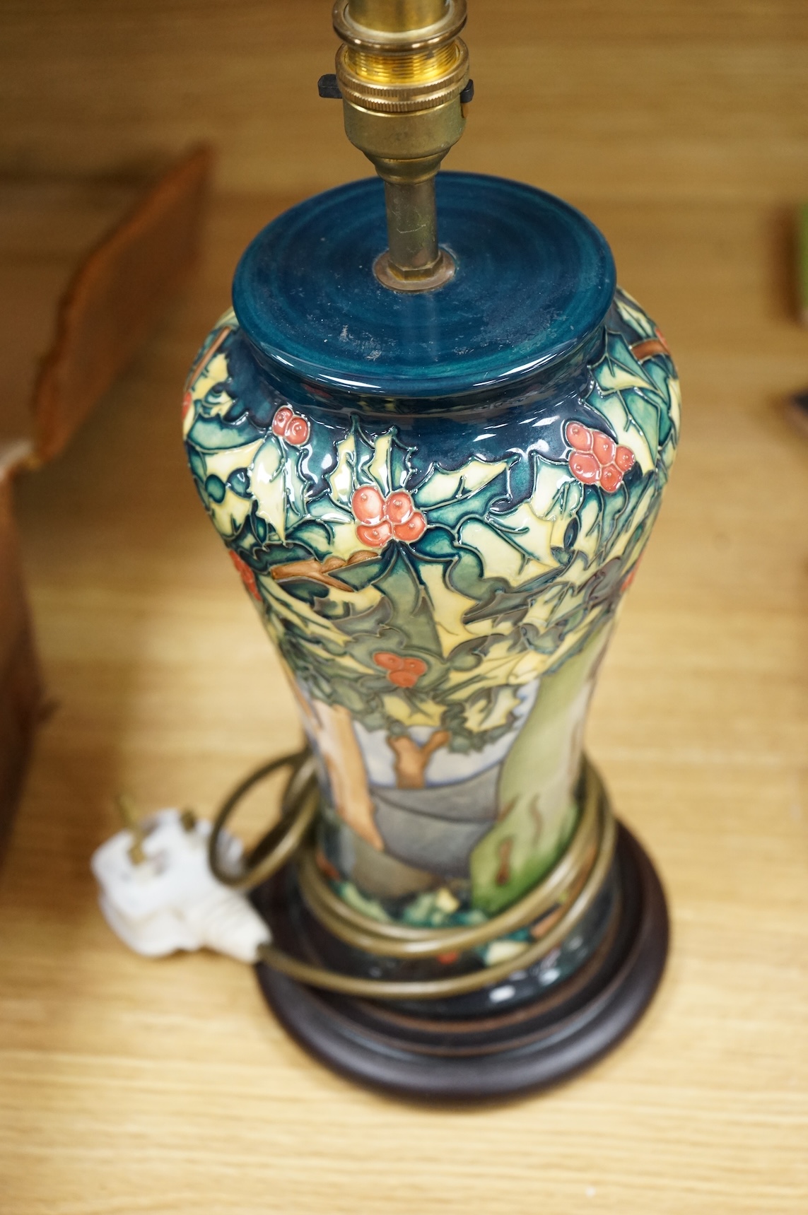 A Moorcroft lamp base decorated in the Holly Hatch pattern, 37cm high including the fitting